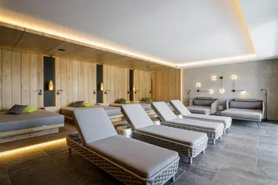 a hospital room with a bunch of chairs and beds at Hotel Mitlechnerhof in Schenna