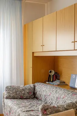 a microwave sitting on top of a wooden cabinet at Cèsa Silvano in Rocca Pietore