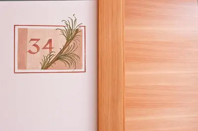 a wooden door with a number on it at Pederü in San Vigilio Di Marebbe