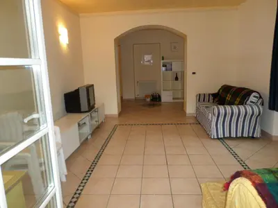 a living room with a tv and a couch at San Cristoforo in Canazei