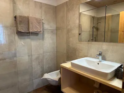 a bathroom with a sink and a mirror at Liebharterhof in Valdaora