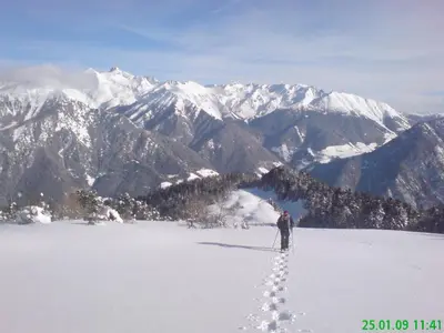 a man standing on top of a snow covered mountain at Pension Schönblick in Campo di Trens
