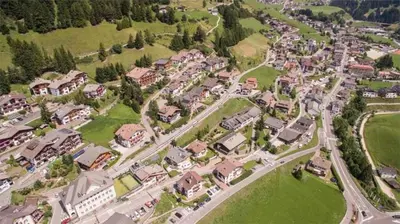an aerial view of a suburb with houses at Hotel Garni Ruscel in Santa Cristina in Val Gardena