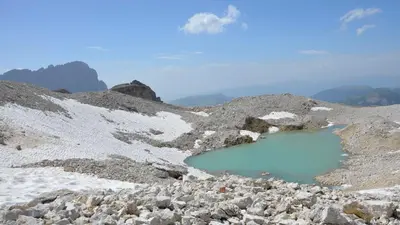 a couple of ponds on the side of a mountain at Hotel Garni Ruscel in Santa Cristina in Val Gardena