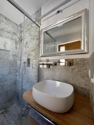 a room with a kitchen and a living room at Apartments Vaiolet in Santa Cristina in Val Gardena