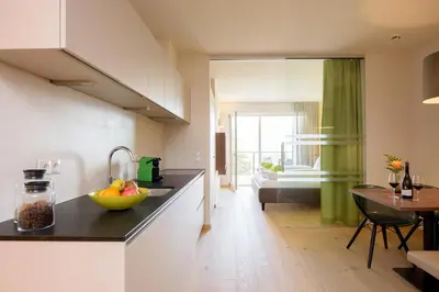 a kitchen with a bowl of fruit on a counter at Brühl Suites&Residence in Caldaro