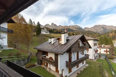 an aerial view of a house in the mountains at Villa Eden in Falcade