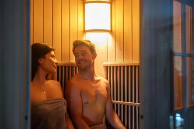 a man and a woman standing in front of a mirror at Camping Zögghof in San Leonardo in Passiria