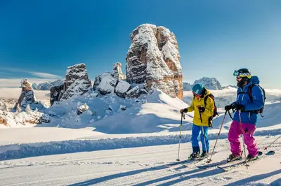 two people on skis on a snow covered mountain at Casa Marmorata in Cortina dʼAmpezzo