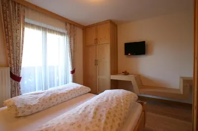 a large room with two bunk beds in it at Lüch da Grones in San Vigilio Di Marebbe