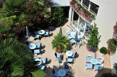 an overhead view of a patio with tables and chairs at Kröllnerhof in Lana