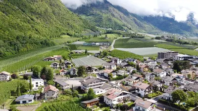 an aerial view of a village in the mountains at Pension Lahn in Rablà