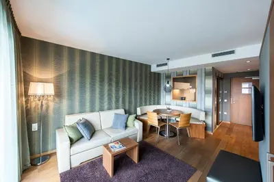 a living room with a couch and a table at ALIA appartements & wellness in Lagundo