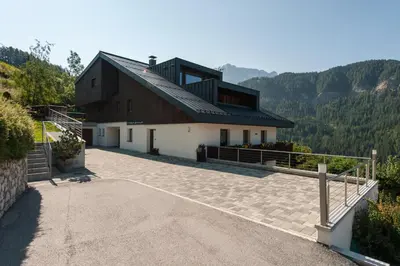 a living room with a couch and a table at Ciasa Saina in La Valle
