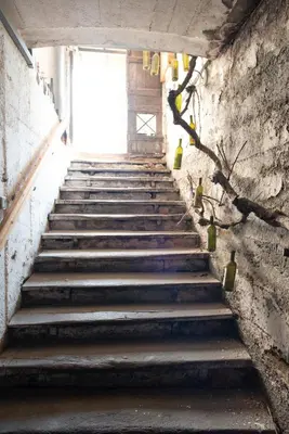 a stairway leading up to a door in a building at Hotel und Residence Johanneshof in Cermes