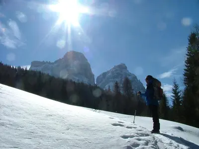 a person on skis on a snow covered slope at Hotel Ca' del Bosco in Selva di Cadore