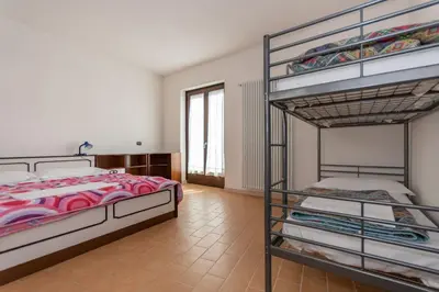 a bedroom with two bunk beds in a room at Villa Simona in Falcade