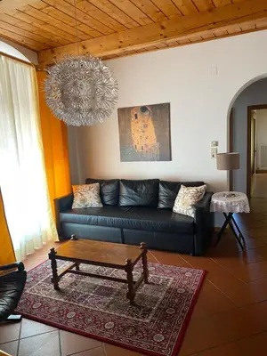 a living room with a couch and a coffee table at Weishof in Termeno
