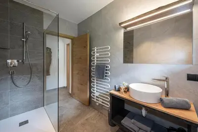 a bathroom with a sink and a shower at Turnerhof in Bressanone