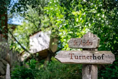 a wooden sign that says st audoria and turnforcer at Turnerhof in Bressanone
