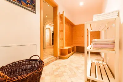 a room with a bunk bed and a hallway at Hotel Rosenheim in Racines