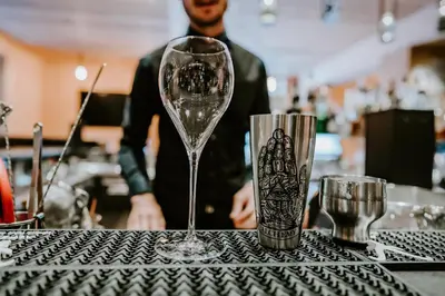 a wine glass sitting on top of a table at Tenne Lodges in Racines