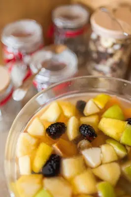 a glass bowl filled with fruit and liquid at Hotel Montana in Cortina dʼAmpezzo