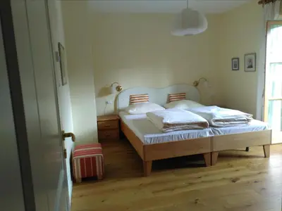 a bedroom with a bed with two pillows on it at Haus Tinkhauser in Vilpiano
