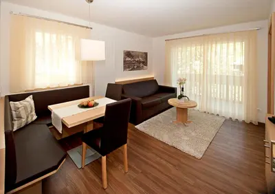 a living room with a couch and a table at Seppmair in Lagundo