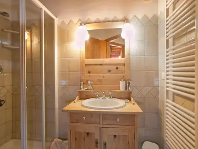 a bathroom with a sink and a shower at Typical Cottage in Bellamonte Italy with bubble bath in Bellamonte