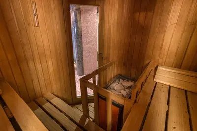 an overhead view of a wooden stairs in a wooden room at Hotel Villa Argentina in Cortina dʼAmpezzo