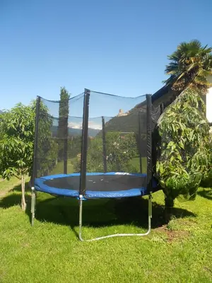 a trampoline in the grass in a field at Garni Unterspeiser in Terlano