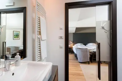 a bathroom with a sink and a mirror at Hotel MAYR in Castelrotto
