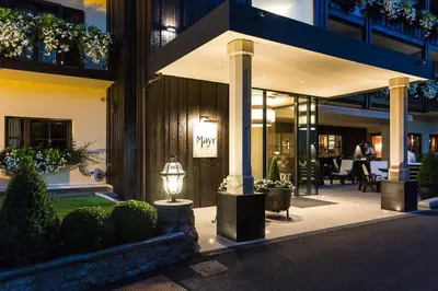 a building with a street light in front of it at Hotel MAYR in Castelrotto