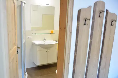 a bathroom with a sink and a mirror at Cesa Setil in Ortisei