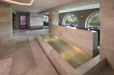 a sauna with a pillar in the middle at Gartenhotel Völser Hof - Adults Only in Fiè