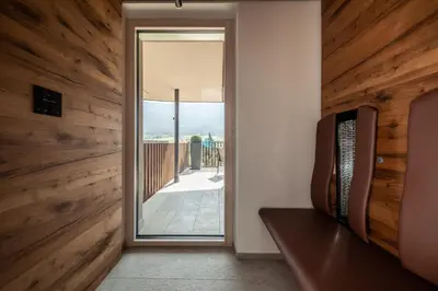 a room with a door leading to a patio at B&B Boutiquehotel Clara in Brunico
