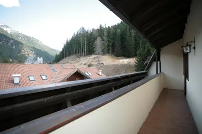 a balcony with a view of a mountain at Appartamenti Cercenà Deluxe in Canazei