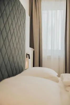 a balcony with a view of the mountains at Feichter Hotel & Living in Bolzano