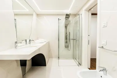 a bathroom with a sink and a shower at Apartments Villa Venezia Luxury in Ortisei