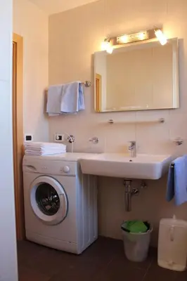 a bathroom with a toilet and a shower at Ciasa Nea in Longega