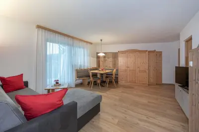 a living room with a couch and a table at Bergdiamant in Maranza