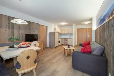 a living room with a couch and a table at Bergdiamant in Maranza