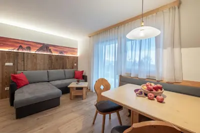 a living room with a couch and a table at Bergdiamant in Maranza