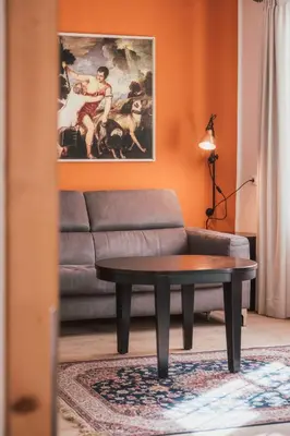 a black and white chair in a room at Residence Traube in Bressanone