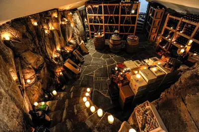 an overhead view of a wine tasting room with lights at Romantik Hotel Turm in Fiè