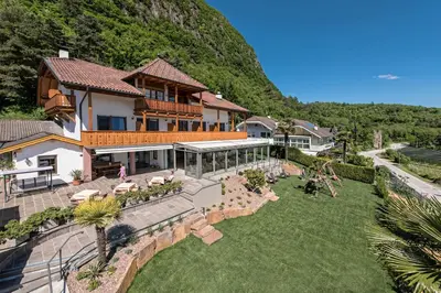 an aerial view of a house with a yard at Pension Irma in Caldaro