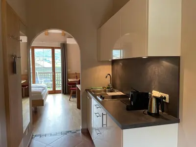 a kitchen with a sink and a counter top at Ansitz Waldner Oberwirt in Marlengo
