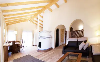 a living room with a couch and a table at Ansitz Waldner Oberwirt in Marlengo