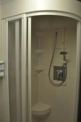 a shower in a bathroom with a toilet at Garni Schwarzenstein in Campo Tures
